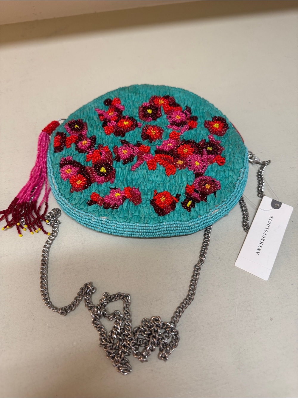 Anthropologie Turquoise Beaded Floral Crossbody with Pink Tassel